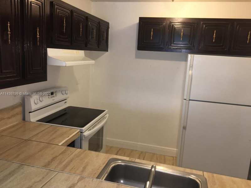 498 NW 165th St Rd # D205, Miami FL 33169