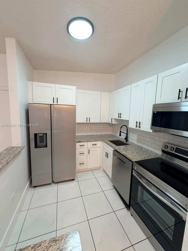 9499 W Mcnab Rd # 208, Tamarac FL 33321