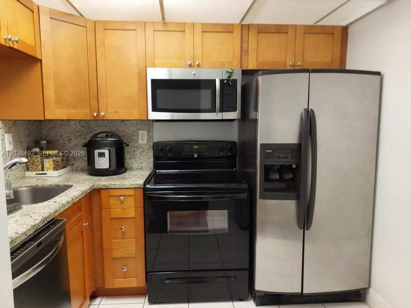 486 NW 165th St Rd # 103, Miami FL 33169